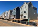 Row of new two-story homes featuring diverse color schemes in a growing neighborhood at 504 Aberdeen Meadow Ln, Acworth, GA 30102