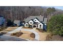 Luxury home with detached garage and circular driveway nestled in the woods at 5152 Boulder Bluff Way, Suwanee, GA 30024