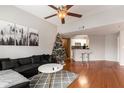 Spacious living room with hardwood floors, a Christmas tree and comfy seating at 1250 Parkwood Se Cir # 2314, Atlanta, GA 30339