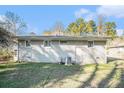 House's back elevation and view of the backyard at 3212 Ward Sw Dr, Atlanta, GA 30354