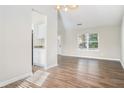 Bright dining area with hardwood floors and kitchen access at 5063 S Woodbridge Trl, Stone Mountain, GA 30088