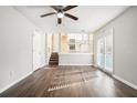 Spacious living room with hardwood floors and access to a deck at 5063 S Woodbridge Trl, Stone Mountain, GA 30088
