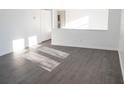 Bright living room with gray vinyl plank flooring and lots of natural light at 2655 Brandenberry Dr, Decatur, GA 30034