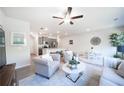 Bright open living room and kitchen featuring modern decor, wood floors, and neutral color scheme at 257 Whitetail Cir, Canton, GA 30115