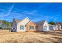 Traditional home with a well-manicured lawn, multiple garages and brick and siding at 4541 Old Highway 138 Sw, Loganville, GA 30052