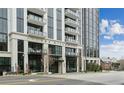 Modern condo building boasting a sleek facade, multiple balconies, and upscale architectural design at 2425 Peachtree Ne Rd # 1106, Atlanta, GA 30305