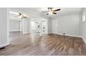 Spacious living room features hardwood floors, ceiling fans and neutral paint at 1751 Nathan Ln, Austell, GA 30168