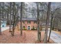 Two-story brick home, two car garage, tree-lined lot at 1920 Shoreline Trce, Grayson, GA 30017