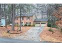 Brick house with two car garage and driveway at 1920 Shoreline Trce, Grayson, GA 30017
