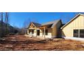 New construction home, showcasing its side profile and covered porch at 331 Morgan Rd, Temple, GA 30179