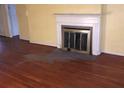 Living room with hardwood floors and fireplace, offering a cozy and inviting space at 138 Le Brun Ne Rd, Atlanta, GA 30342