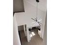 High ceiling view of the main living area and kitchen with modern chandelier at 2254 Wellington Cir, Lithonia, GA 30058