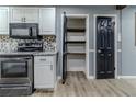 Modern kitchen with stainless steel appliances and pantry at 4598 Flint Hill Rd, Austell, GA 30106