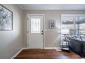 Inviting entryway with decorative glass door, hardwood floors, and warm, neutral paint colors at 516 Richards Rd, White, GA 30184