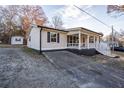 The side view of this house features a long driveway and a well-maintained lawn at 516 Richards Rd, White, GA 30184