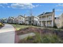 Row of houses with nicely landscaped yards at 241 Thompson St, Alpharetta, GA 30009