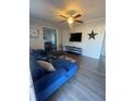 Spacious living room featuring a sectional sofa and large TV at 534 Hamilton E Holmes Dr, Atlanta, GA 30318