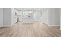 Modern kitchen with white cabinets and an island at 3404 Mount Olive Rd, Atlanta, GA 30344