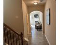 Inviting entryway showcases an archway into the cozy living room with fireplace and media center at 3885 Nixon Grove Dr, Douglasville, GA 30135