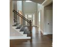 Elegant entryway with hardwood floors and a staircase at 4010 Sierra Vista Cir, Cumming, GA 30040
