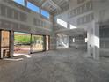 Spacious living room with soaring ceilings, large windows, and sliding glass doors, ready for customization at 839 Braselton Hwy, Lawrenceville, GA 30043