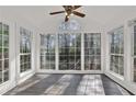 Inviting sunroom with large windows offering natural light and wooded views at 2707 Country Park Se Dr, Smyrna, GA 30080