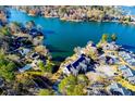 Beautiful aerial view of lakeside homes, showcasing the community's location on a picturesque lake surrounded by lush greenery at 706 Berry Ct, Villa Rica, GA 30180