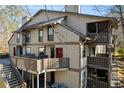 Townhouse exterior with a deck and surrounding trees at 1608 Woodcliff Ne Dr, Atlanta, GA 30350
