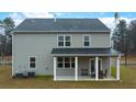 Two-story house with a covered patio and fenced backyard at 5447 Flat Rock Point, Stonecrest, GA 30038