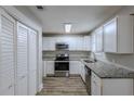 Newly renovated kitchen featuring granite countertops and stainless steel appliances at 905 Fairburn Nw Rd, Atlanta, GA 30331