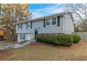 Two-story house with landscaping and a gray exterior at 2098 Mallard Crst, Lithonia, GA 30058