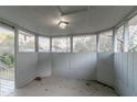 Empty screened porch with white walls and wood floors at 2098 Mallard Crst, Lithonia, GA 30058