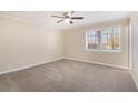 Spacious bedroom with neutral carpeting and large window at 2751 Lloyd Rd, Decatur, GA 30034