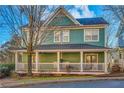 Two-story house with a wraparound porch at 225 Carlyle Park Ne Dr, Atlanta, GA 30307