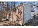 Brick and wood-sided house with carport at 2970 Eleanor Nw Ter, Atlanta, GA 30318