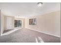Spacious living room with carpet and sliding glass door at 2970 Eleanor Nw Ter, Atlanta, GA 30318