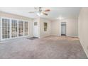 Spacious living room with large windows and neutral carpet at 1983 Wee Kirk Se Rd, Atlanta, GA 30316