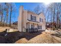 Charming two-story home featuring a cozy front porch and neutral siding at 3884 Blue Granite Way, Conley, GA 30288