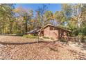 Ranch style home nestled in a wooded setting at 2612 Country Club Se Dr, Conyers, GA 30013