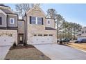 Modern two-story townhome with light brick and gray accents at 4195 Waratah Way, Mableton, GA 30126