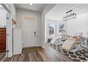 Stylish sitting room featuring hardwood floors, large windows, and natural light at 3330 Deaton Trl, Buford, GA 30519