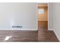 Living room with hardwood floors and an open doorway at 4412 Rustic Wood Dr, Stone Mountain, GA 30083