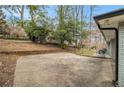 A large concrete patio and private backyard offer ample space for outdoor entertaining and recreation at 2418 Brookdale Ne Dr, Atlanta, GA 30345