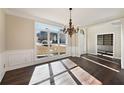 Formal dining room with hardwood floors, chandelier, and built-in shelving at 6315 Sturbridge Ln, Cumming, GA 30040