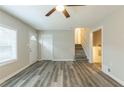 Spacious living area with wood-look floors, and stairs to the upper level at 3293 Hobart Nw Dr, Atlanta, GA 30318