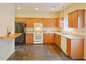 Kitchen with wood cabinets and dark floor tile at 2024 Appaloosa Way, Conyers, GA 30012