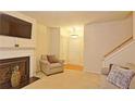 Living room with fireplace and neutral carpeting at 2024 Appaloosa Way, Conyers, GA 30012