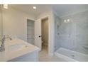 Spa-like bathroom with double sinks, a large shower, and ample storage at 4521 Twinberry Dr, Powder Springs, GA 30127