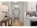 This entryway features hardwood floors, light gray walls, and entry to the kitchen at 4521 Twinberry Dr, Powder Springs, GA 30127