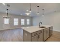 Modern kitchen island with quartz countertops and stainless steel appliances at 4521 Twinberry Dr, Powder Springs, GA 30127